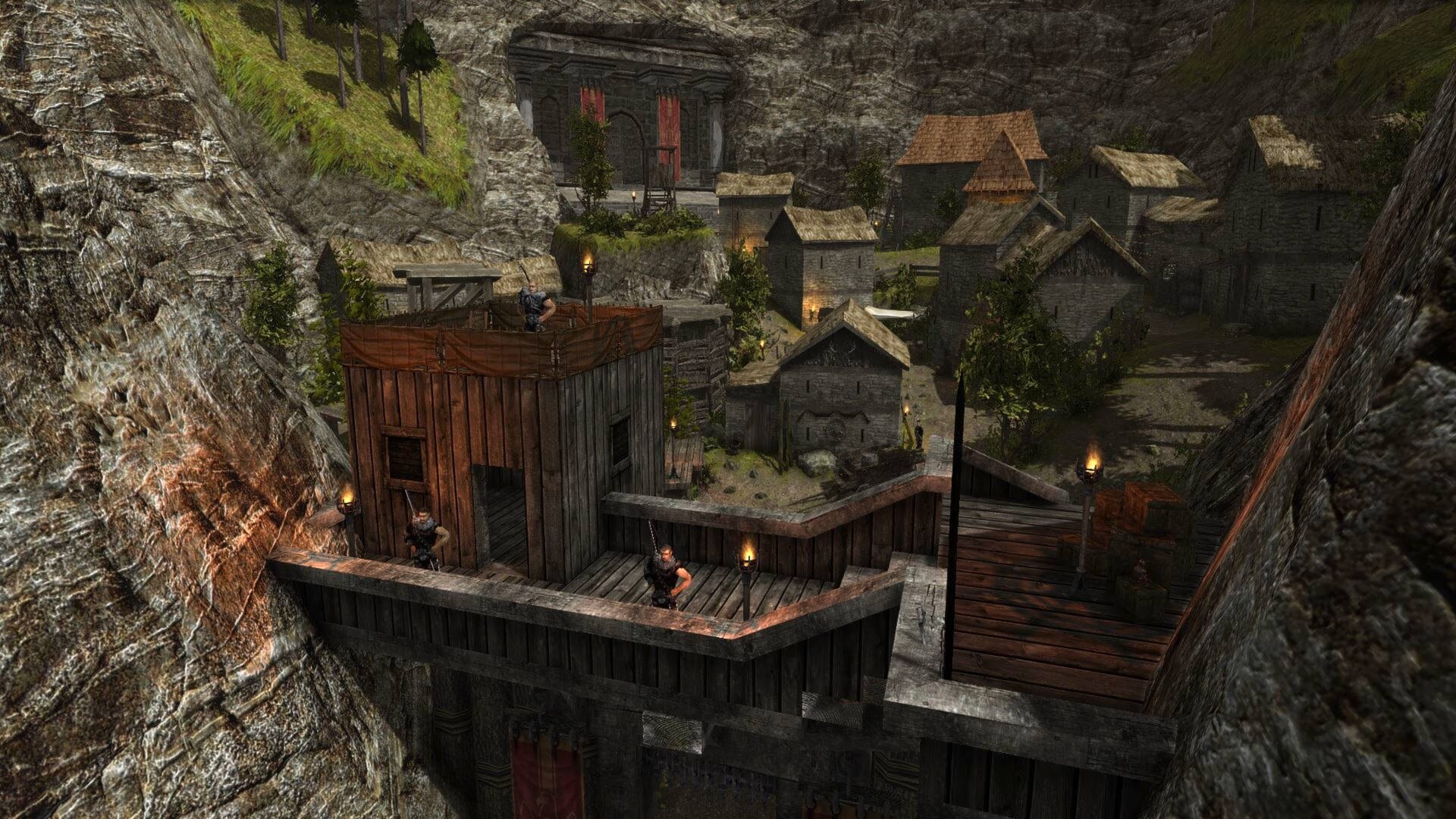 Screenshot aus der Gothic-2-Mod Legend of Ahssun. Zu sehen ist ein Bergtal, in welchem einige Häuser stehen. Im Hintergrund ist ein großer Tempeleingang zu sehen, der in den Fels geschlagen wurde. Der Eingang in das Tal wird mit einem massiven Palisaden-Wall geschützt. 