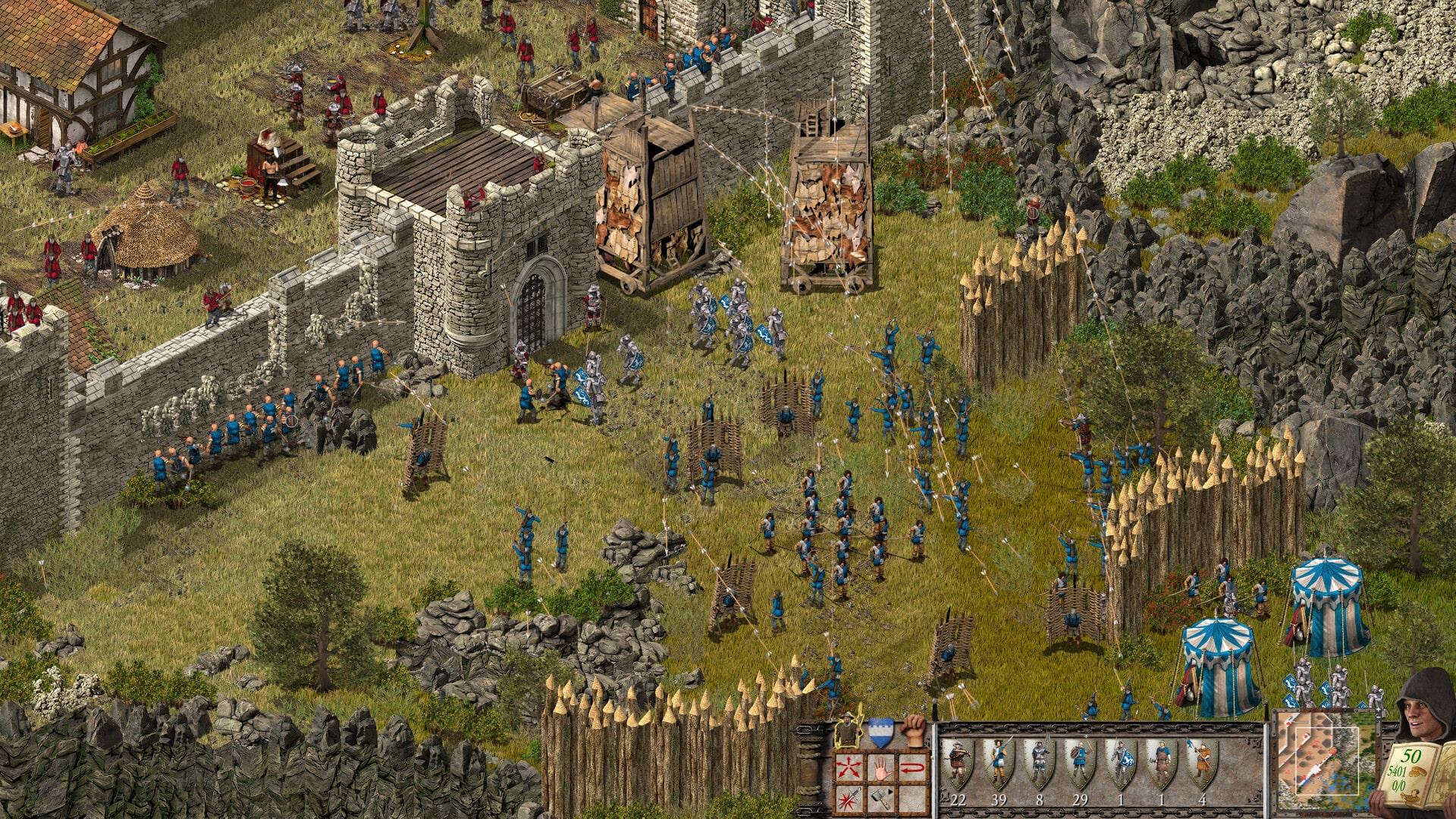 Screenshot der Stronghold Definitive Edition. Zu sehen ist eine Festung, die von Soldaten angegriffen wird. Belagerungstürme bewegen sich zu den Wällen, während einige Krieger die Mauern niederreißen. 