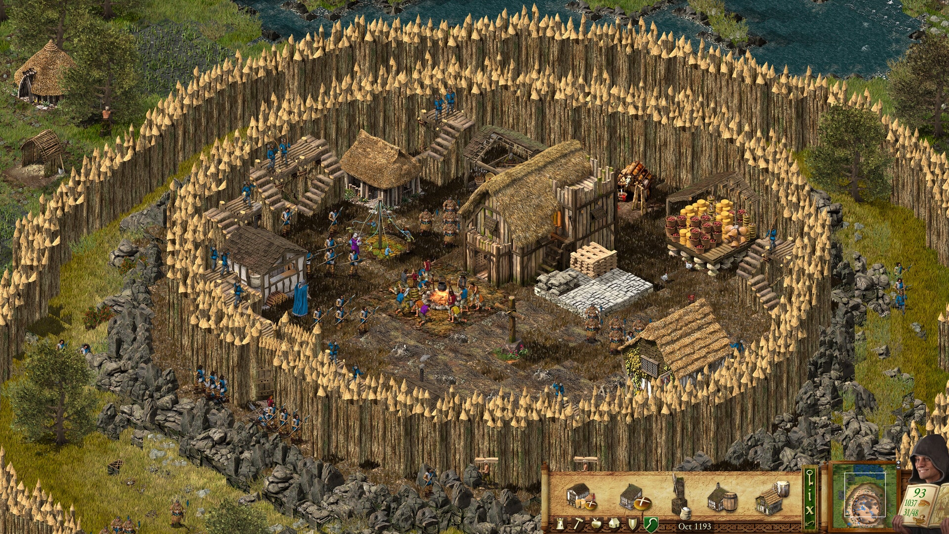 Screenshot der Stronghold Definitive Edition. Zu sehen ist eine kleine Festung mit Holzpalisaden.