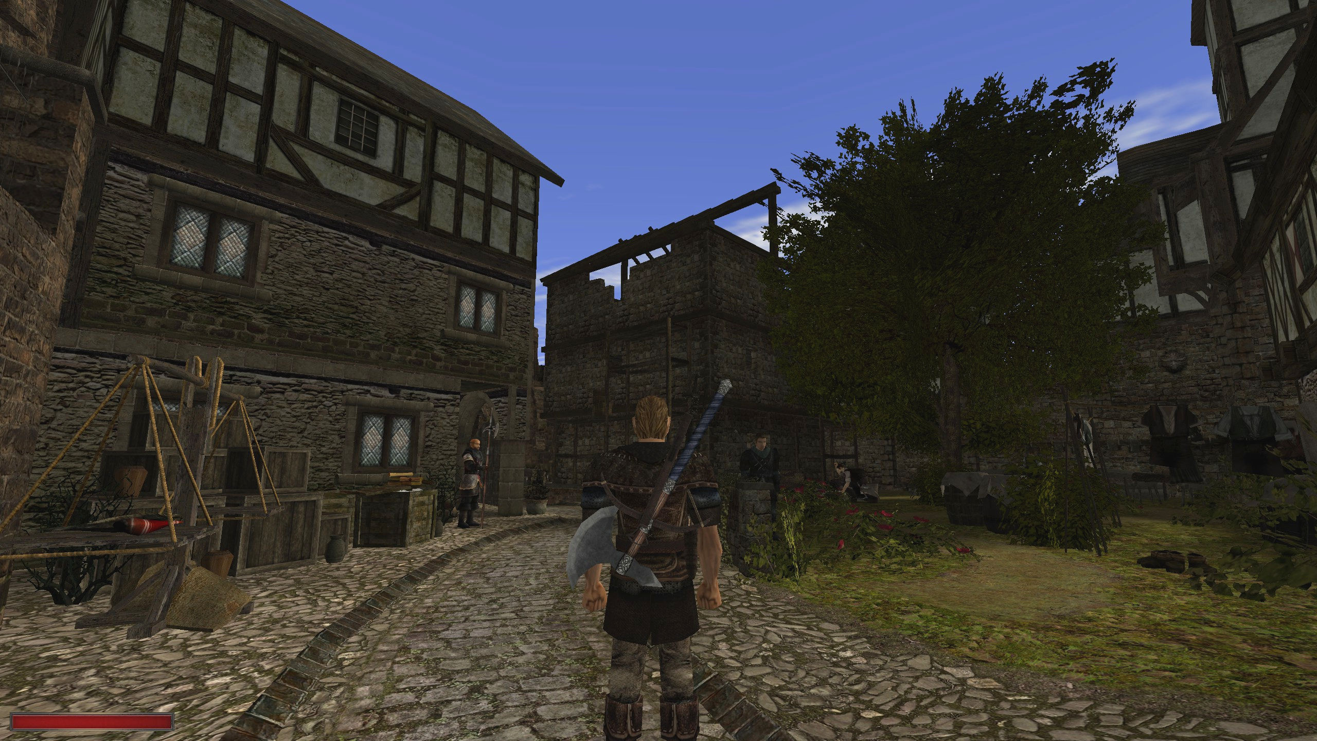Screenshot Die Chroniken von Myrtana: Archolos. Zu sehen ist der Held des Spiels, der in der Stadt Archolos steht. Zu sehen sind imposante Häuser, Marktstände, Bewohner und eine Stadtwache. 